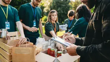 Volunteers packing food boxes