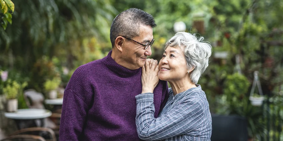 Retired couple smiling at each other