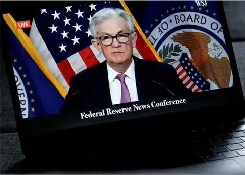 FED Chair Jerome Powell announcing rate cut.